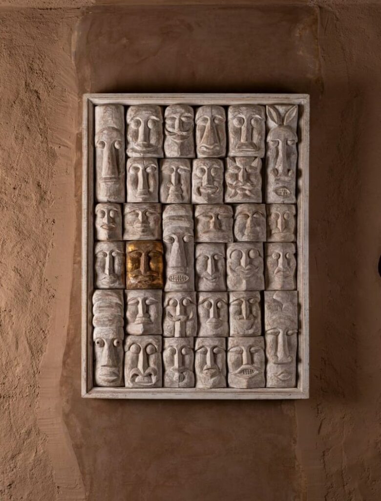 10 Creative Ways to Use Handicraft Wall Decor in Every Room 5 Collection of unique carved faces.