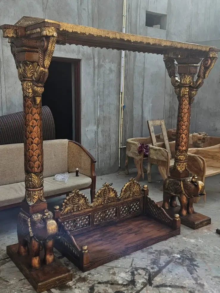 The Timeless Beauty of Handcrafted Wooden Jhula: A Complete Buying Guide 2 Ornate wooden swing with intricate carvings.